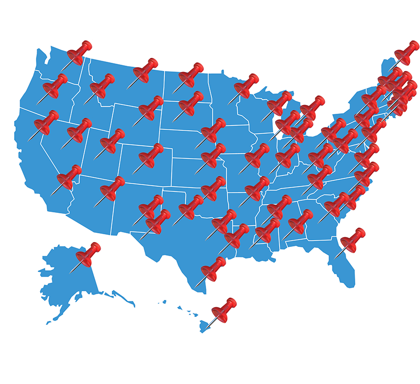 A map of the USA with thumb tacks in each state.